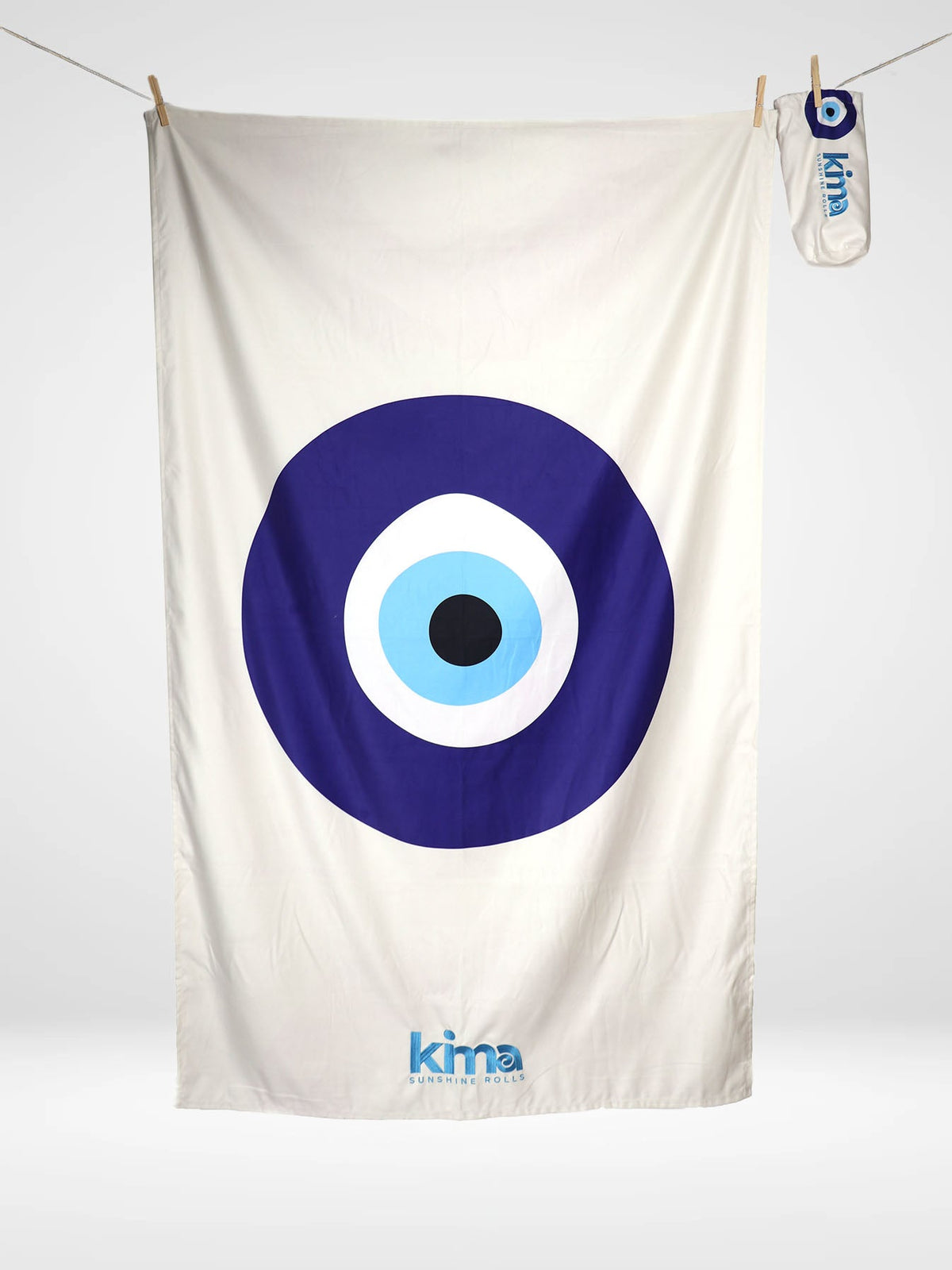 Serviette de plage Kima Œil Grec, blanc, œil grec bleu, à plat - Ô Cabanon La Ciotat