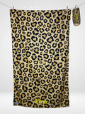 Serviette de plage Kima Léopard, léopard beige et noir, à plat - Ô Cabanon La Ciotat